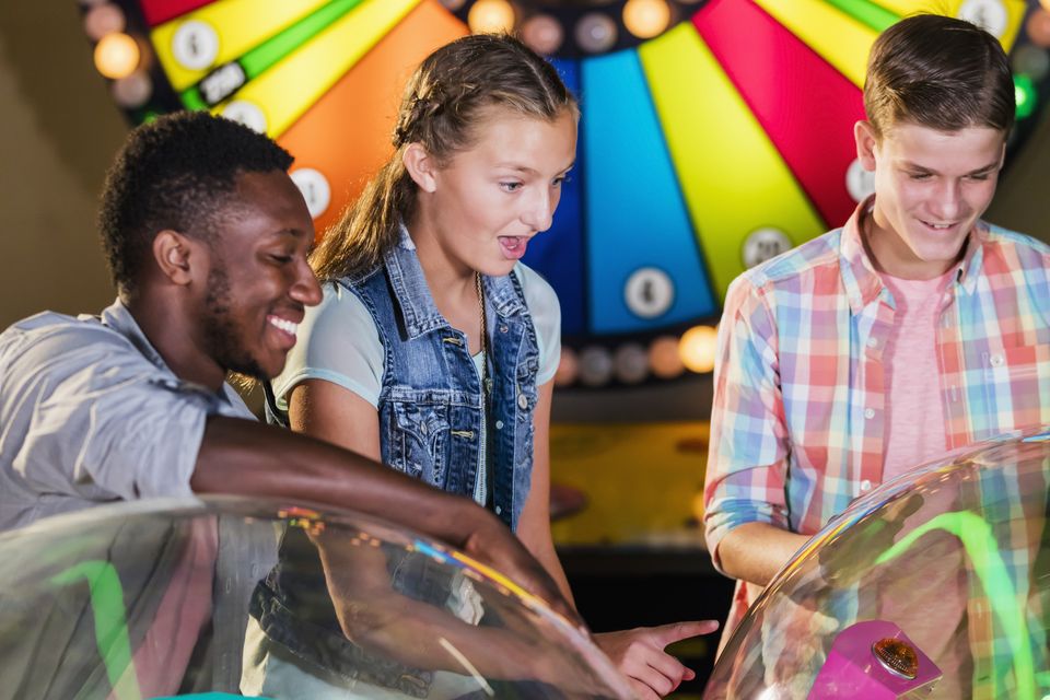 Amusement arcades now are colourful introductions to gambling. Photo: Picture posed/Getty